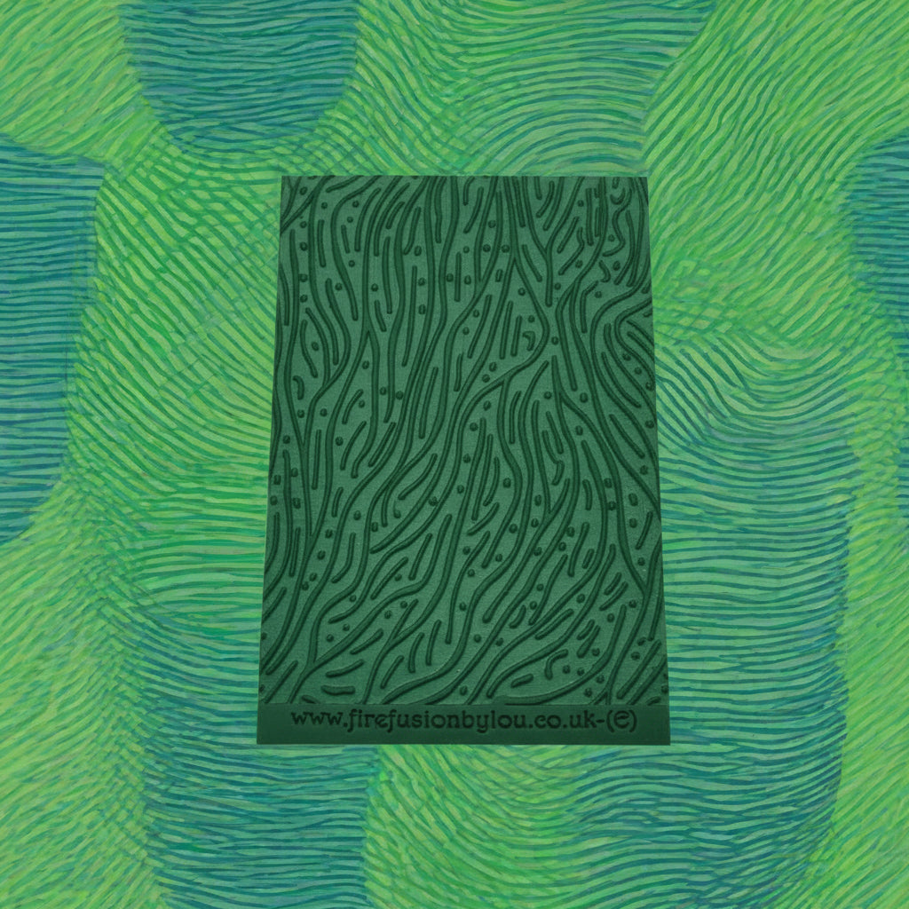 A pattern embossed texture mat. This texture mat will give you an embossed effect on metal clay or polymer clay.