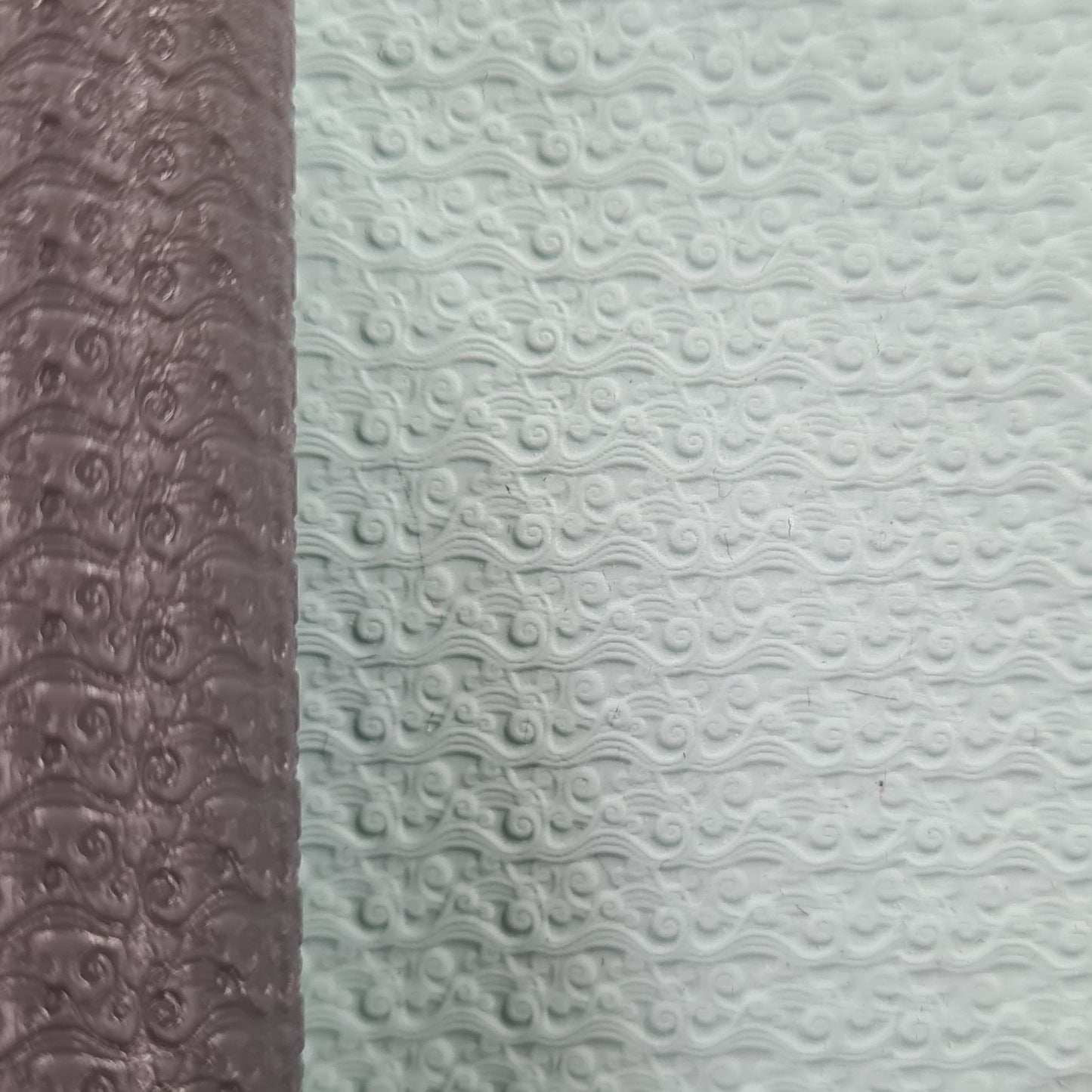 Two textured one brown roller and white wave in clay.