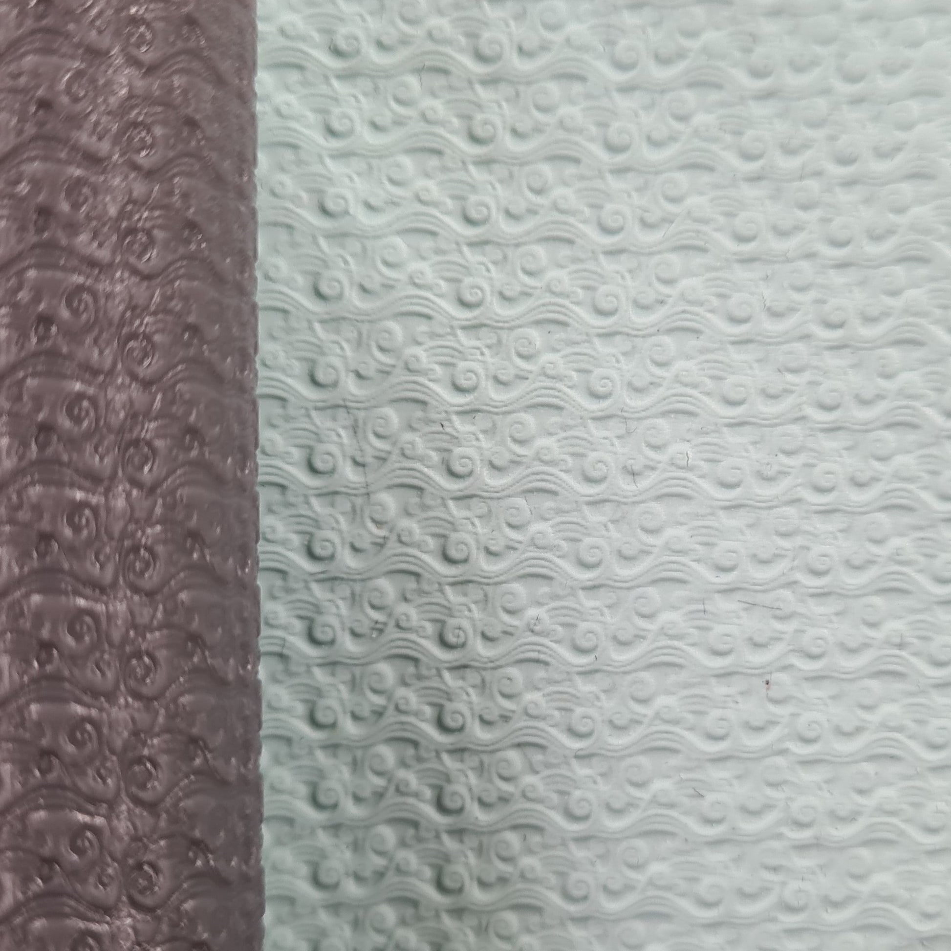 Two textured one brown roller and white wave in clay.