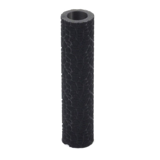 A black textured roller for metal clay or polymer clay, with an ergonomic shape designed to fit under four fingers for rolling.