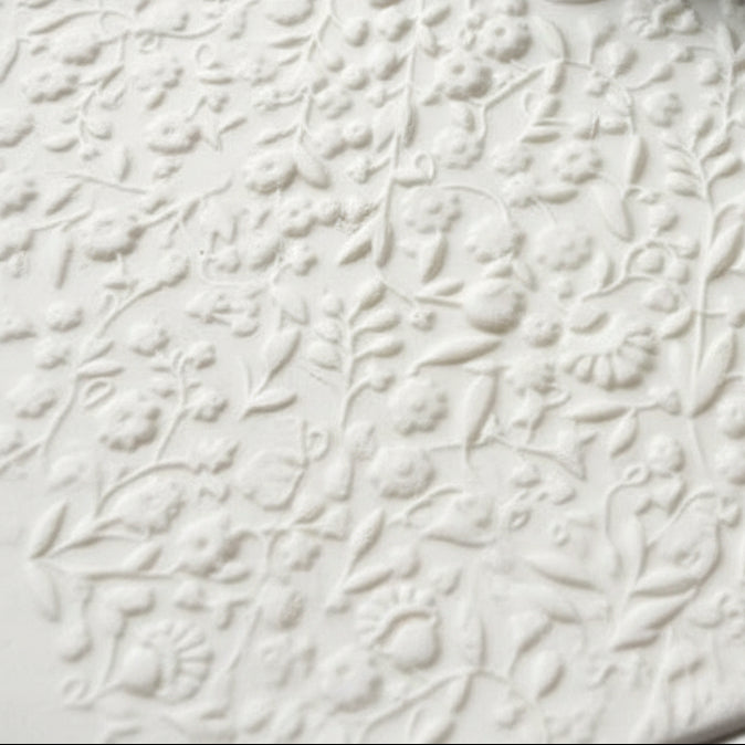 Decorative floral pattern on a textured surface