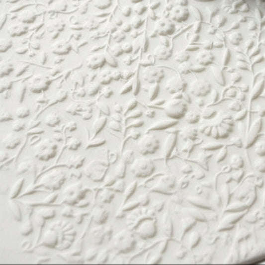 Decorative floral pattern on a textured surface