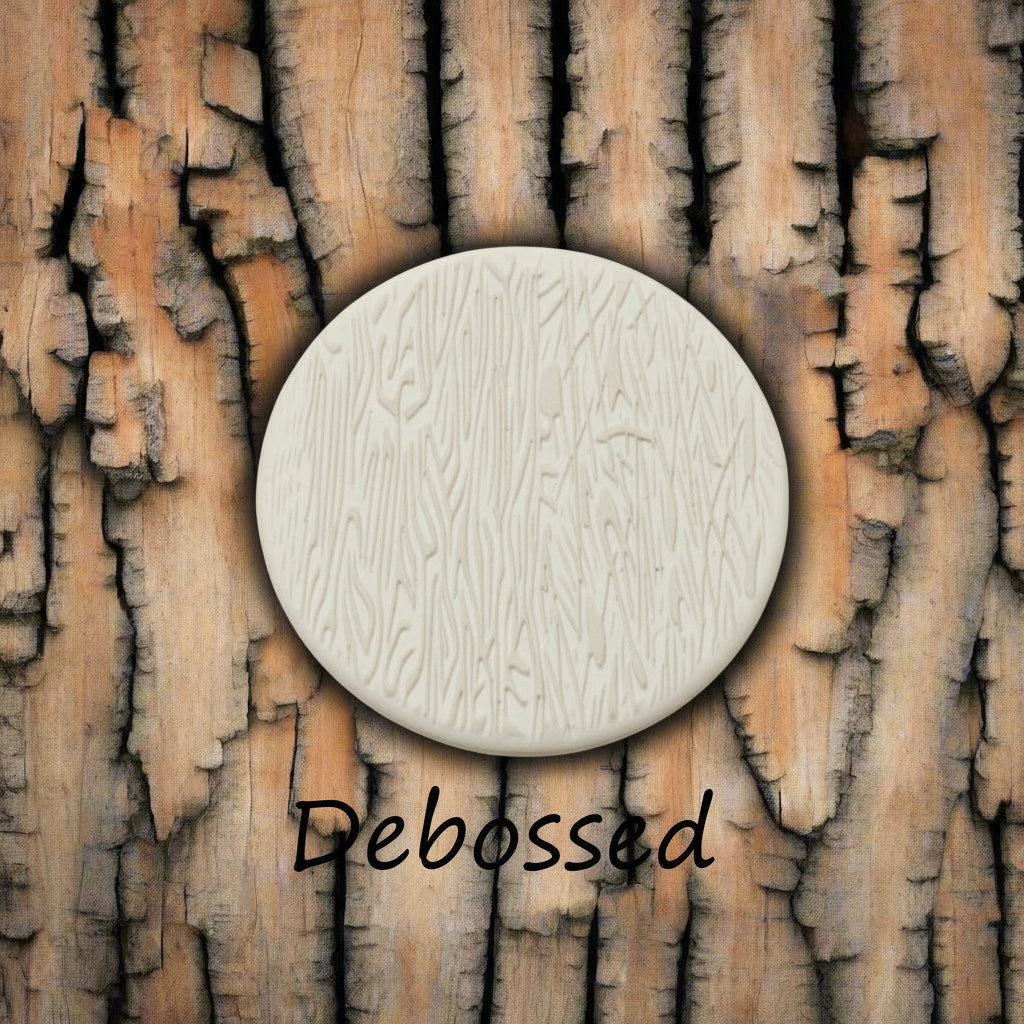 Tree bark designs embossed in clay Using a  debossed texture mat. This will give you an idea of what it will look like on metal clay or polymer clay.