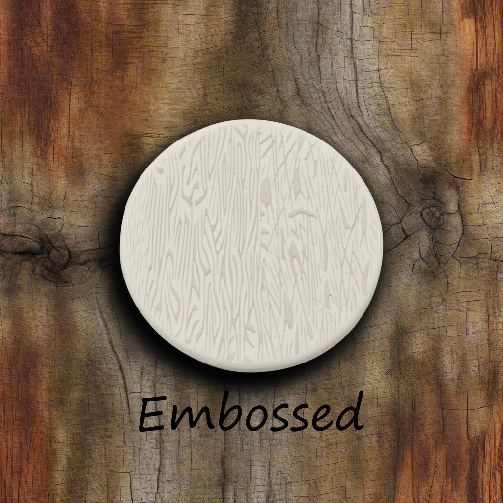 Tree bark designs debossed in clay Using a  embossed texture mat. This will give you an idea of what it will look like on metal clay or polymer clay.