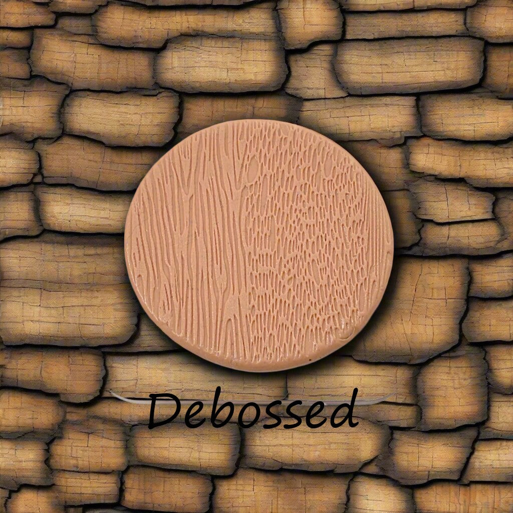 Tree bark designs embossed in silly putty Using a  debossed texture mat. This will give you an idea of what it will look like on metal clay or polymer clay.