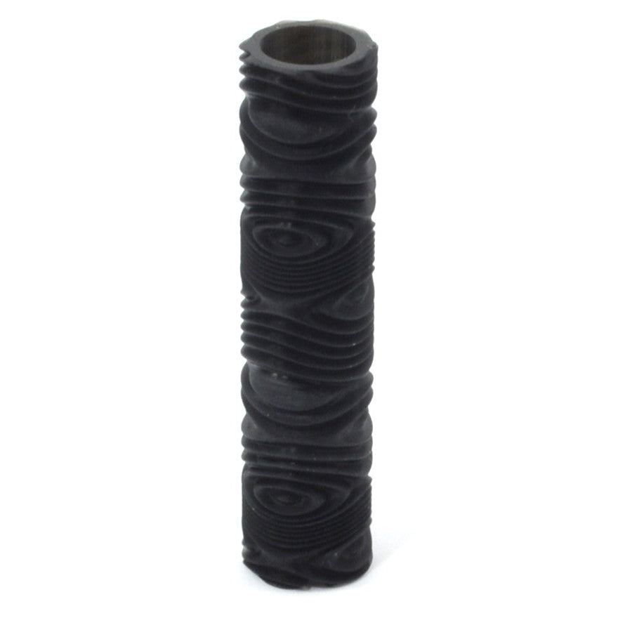 A black textured roller for metal clay or polymer clay, with an ergonomic design to fit under four fingers.