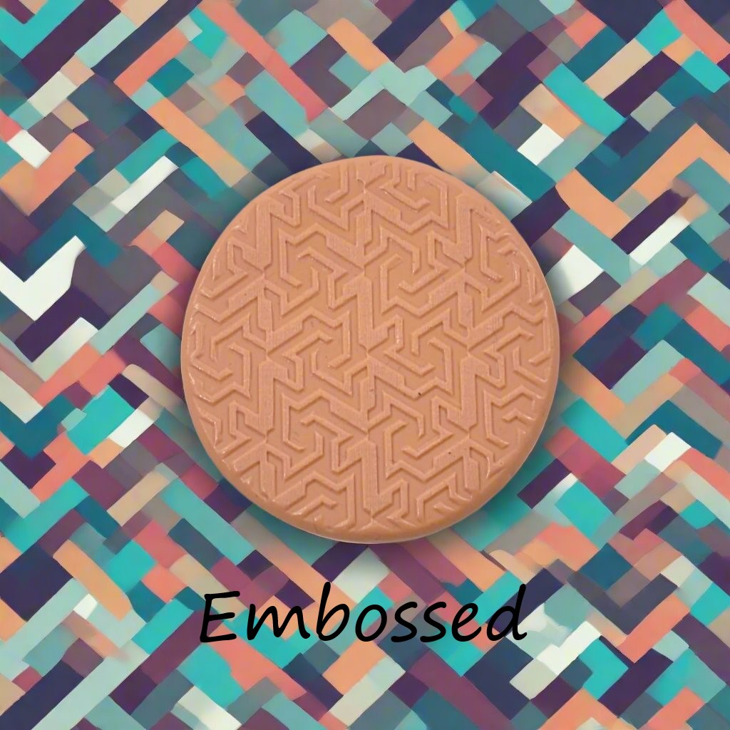geometric design debossed in silly putty Using a  embossed texture mat. This will give you an idea of what it will look like on metal clay or polymer clay