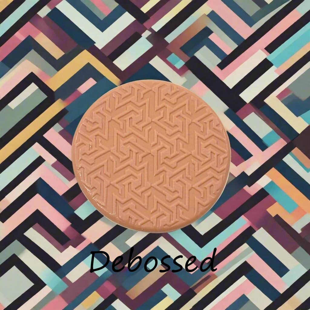 geometric design embossed in silly putty Using a debossed texture mat. This will give you an idea of what it will look like on metal clay or polymer clay