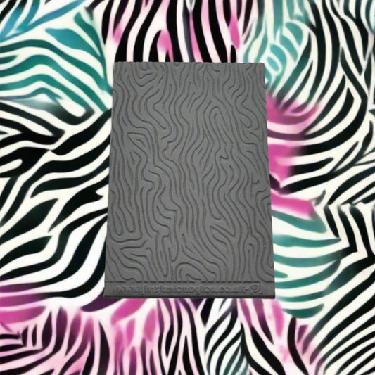 A pattern debossed texture mat in grey material. This texture mat will give you an embossed effect on metal clay or polymer clay.